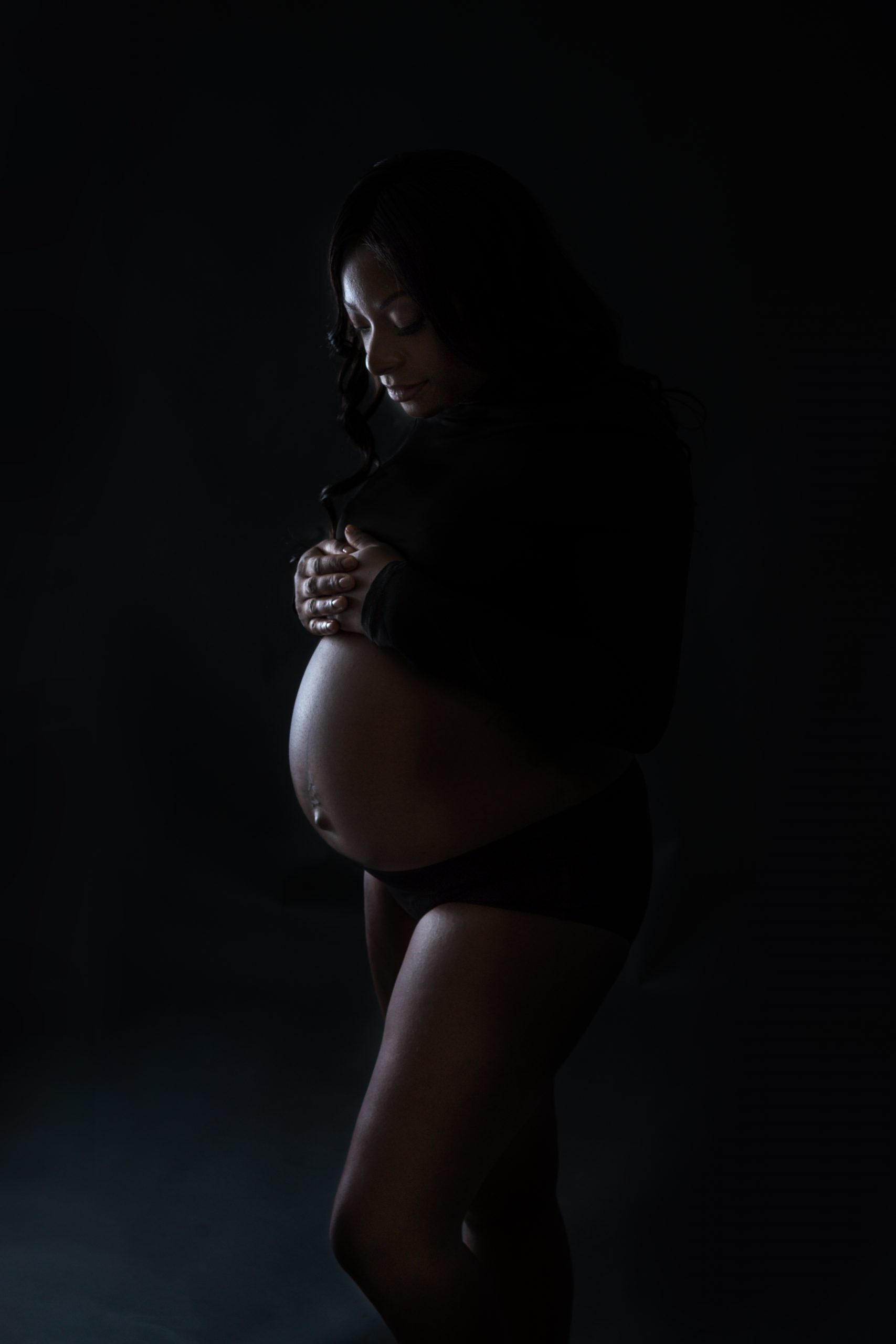 Dramatic Maternity Portrait using Rim Lighting to Highlight Baby Bump by Lin Ellen Studios